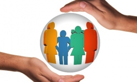 Illustration showing safeguarding image, depicting two hands around a sphere containing outline shapes
  of a man, woman and two children