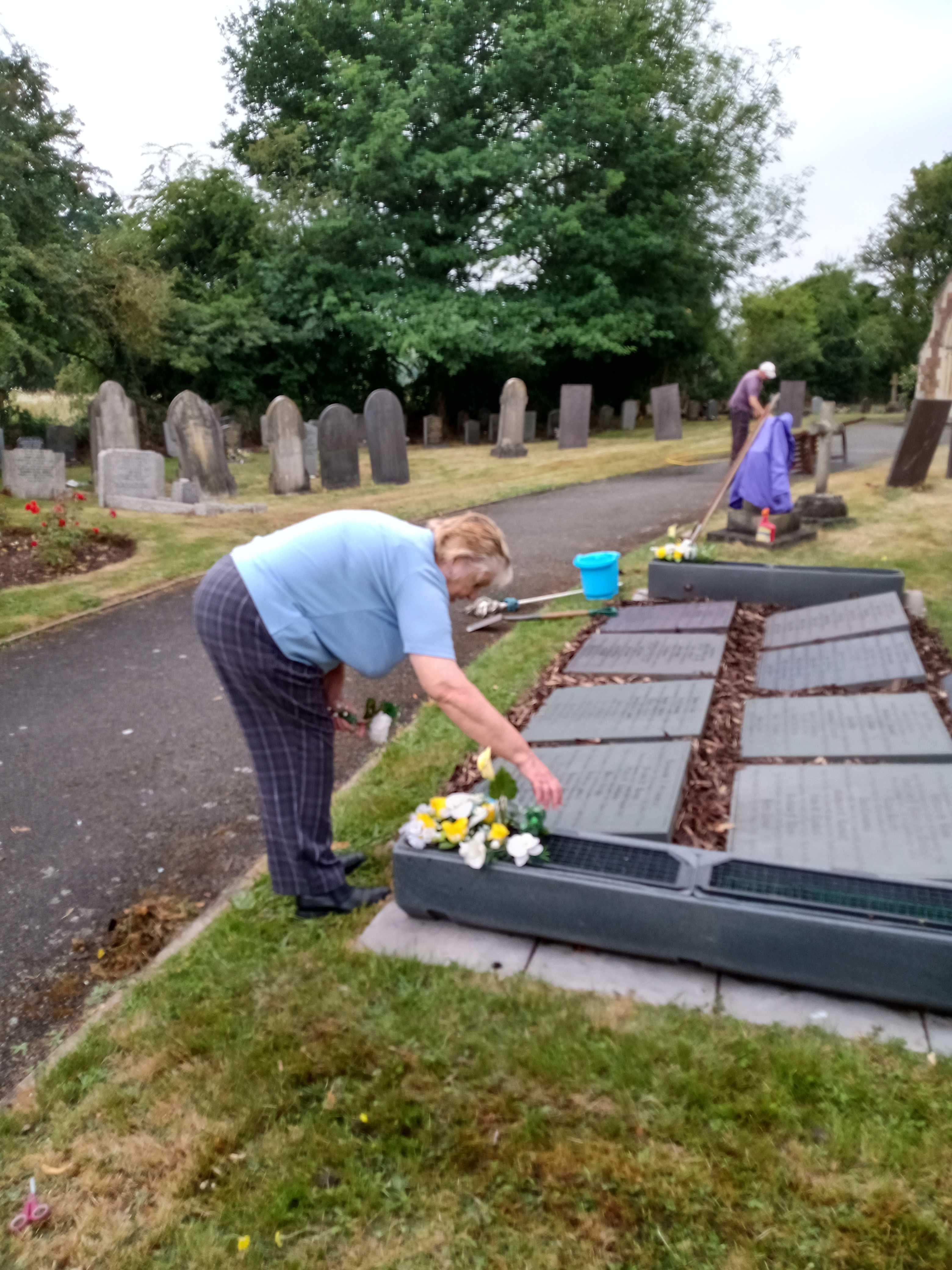 Picture of memorial garden, V adds some flowers to finish things off.
